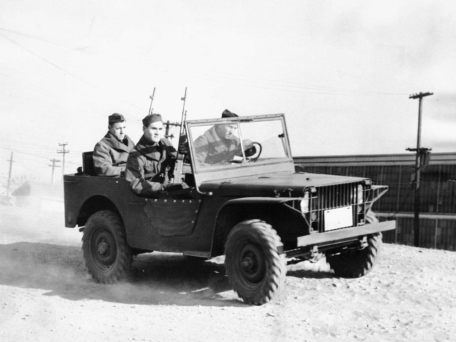 The Ford Pygmy pilot model with three soldiers aboard, a flat-fronted car with its headlights behind a slatted grille.