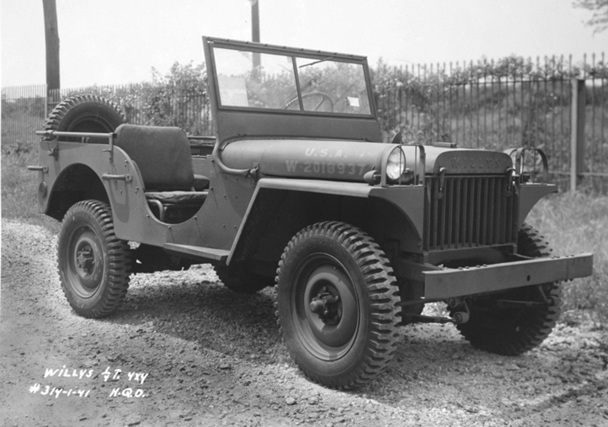 A Willys MA with its windshield up and a spare wheel on the back, photographed from the front left.